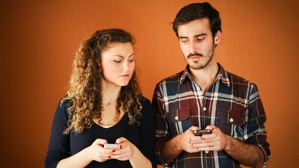 Ilustração de chamas gêmeas enfrentando sentimentos de ciúmes, obsessão e possessividade, simbolizando os desafios emocionais e espirituais na jornada de conexão e cura.